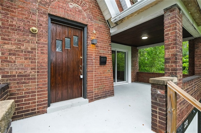 233 E 21st Ave, Munhall, PA 15120 - view of exterior entry featuring brick siding and covered porch