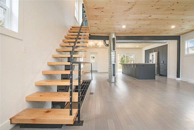 233 E 21st Ave, Munhall, PA 15120 - stairway featuring wood ceiling, plenty of natural light, wood finished floors, and recessed lighting