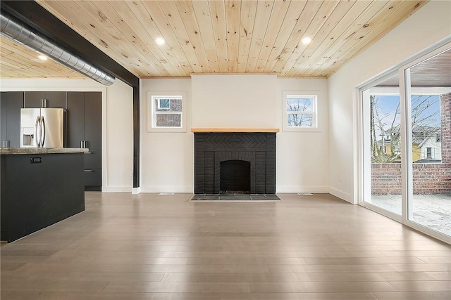 233 E 21st Ave, Munhall, PA 15120 - unfurnished living room featuring recessed lighting, wooden ceiling, a fireplace, and wood finished floors