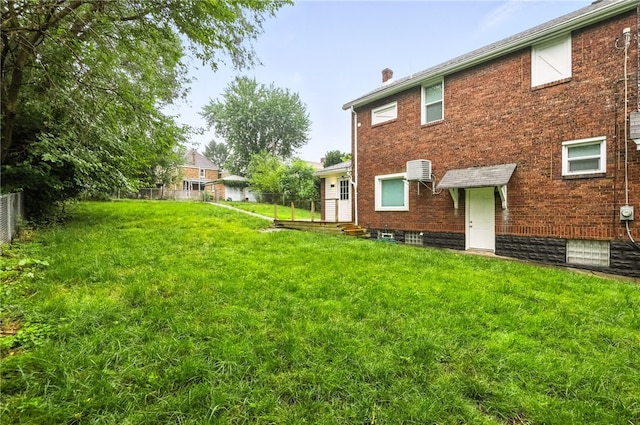 233 E 21st Ave, Munhall, PA 15120 - rear view of property with a chimney and brick siding