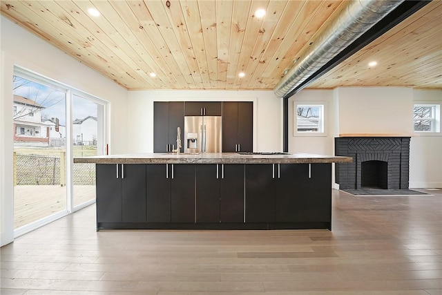 233 E 21st Ave, Munhall, PA 15120 - kitchen featuring stainless steel appliances, recessed lighting, a breakfast bar area, a large island, and light wood-type flooring