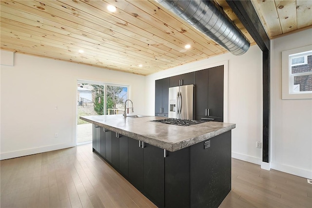 233 E 21st Ave, Munhall, PA 15120 - kitchen with stainless steel appliances, an island with sink, dark cabinets, recessed lighting, and wooden ceiling