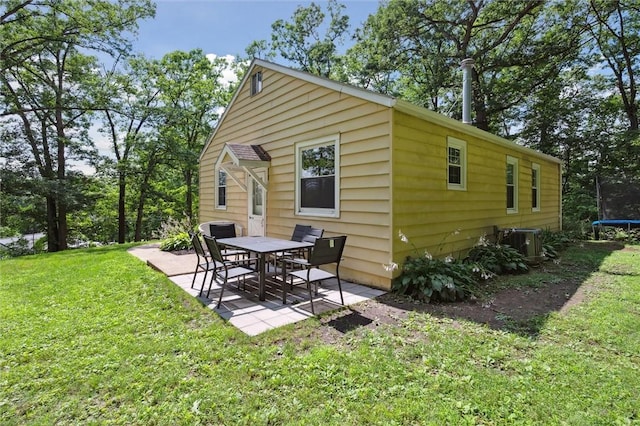516 Shenango Rd, Chippewa Twp, PA 15010 - back of property featuring a trampoline, a patio, and a lawn