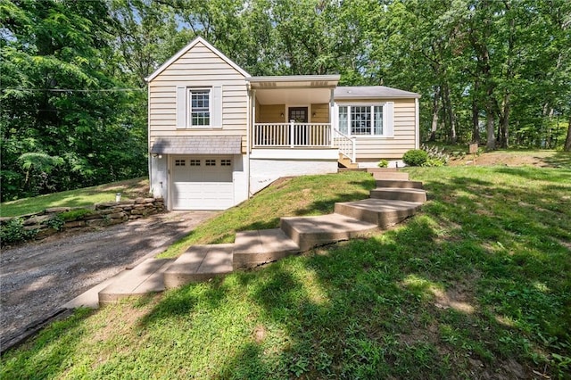 516 Shenango Rd, Chippewa Twp, PA 15010 - view of front of home featuring asphalt driveway, an attached garage, a front lawn, stairway, and covered porch