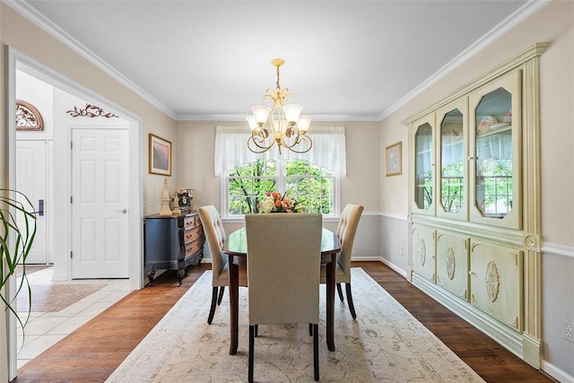 1544 Eldorado Dr, Hopewell Twp, PA 15001 - dining room with a chandelier, crown molding, and wood finished floors