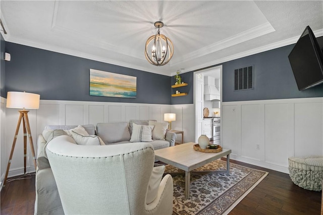 237 Clever Rd, Robinson Twp, PA 15136 - living area featuring a decorative wall, wainscoting, a chandelier, dark wood-type flooring, and ornamental molding