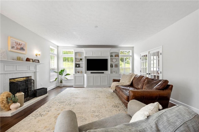 237 Clever Rd, Robinson Twp, PA 15136 - living room featuring a fireplace, dark wood finished floors, and a textured ceiling