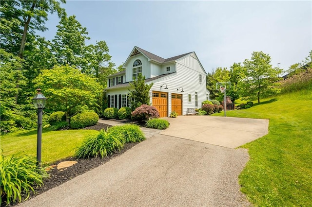 237 Clever Rd, Robinson Twp, PA 15136 - traditional home featuring a garage, a front yard, concrete driveway, and board and batten siding