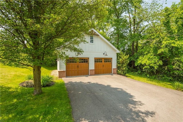 237 Clever Rd, Robinson Twp, PA 15136 - view of home's exterior featuring brick siding, board and batten siding, a detached garage, a lawn, and an outbuilding