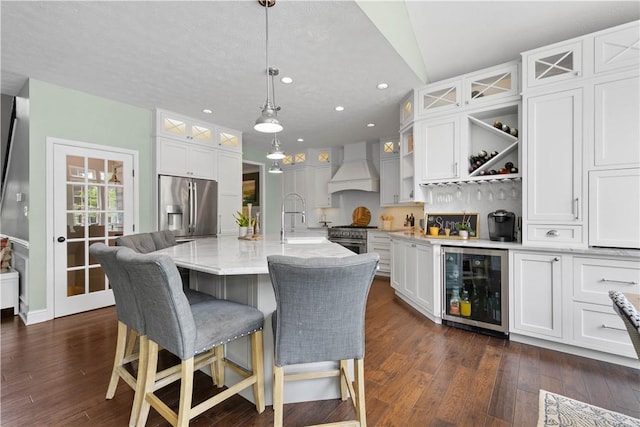 237 Clever Rd, Robinson Twp, PA 15136 - kitchen featuring stainless steel appliances, wine cooler, custom exhaust hood, recessed lighting, and white cabinetry