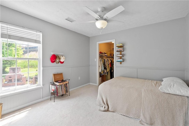 237 Clever Rd, Robinson Twp, PA 15136 - bedroom featuring multiple windows, carpet flooring, a spacious closet, wainscoting, and ceiling fan