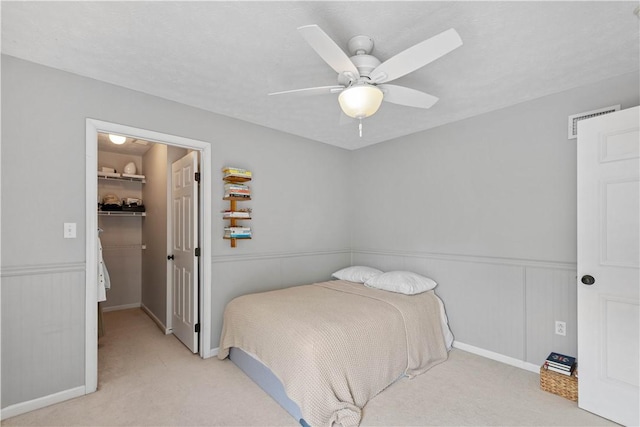 237 Clever Rd, Robinson Twp, PA 15136 - carpeted bedroom featuring a spacious closet, wainscoting, and ceiling fan