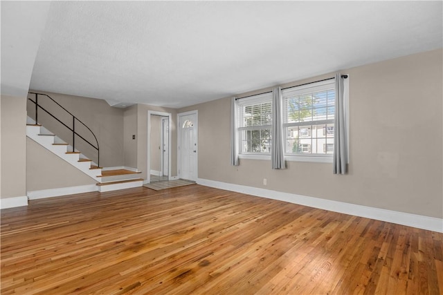 109 Raleigh Ct, Ross Twp, PA 15237 - entrance foyer with wood-type flooring and stairway