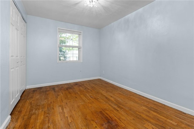 109 Raleigh Ct, Ross Twp, PA 15237 - unfurnished bedroom with a closet and wood-type flooring