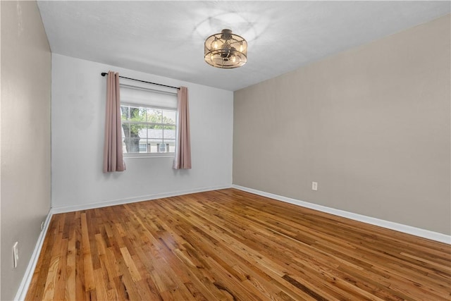 109 Raleigh Ct, Ross Twp, PA 15237 - spare room with wood-type flooring and a chandelier