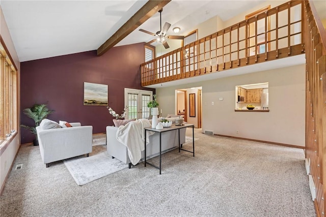 110 Four Seasons Ln, Irwin, PA 15642 - living room with french doors, beam ceiling, carpet, ceiling fan, and high vaulted ceiling