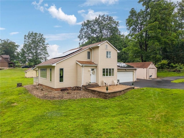 110 Four Seasons Ln, Irwin, PA 15642 - view of front facade with roof mounted solar panels, a front lawn, a storage shed, a garage, and entry steps