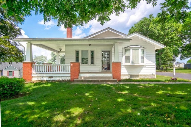 3444 Brodhead Rd, Center Twp, PA 15061 - view of front of house with covered porch, a chimney, and a front lawn