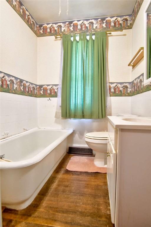 3444 Brodhead Rd, Center Twp, PA 15061 - bathroom with a bath, vanity, and wood finished floors