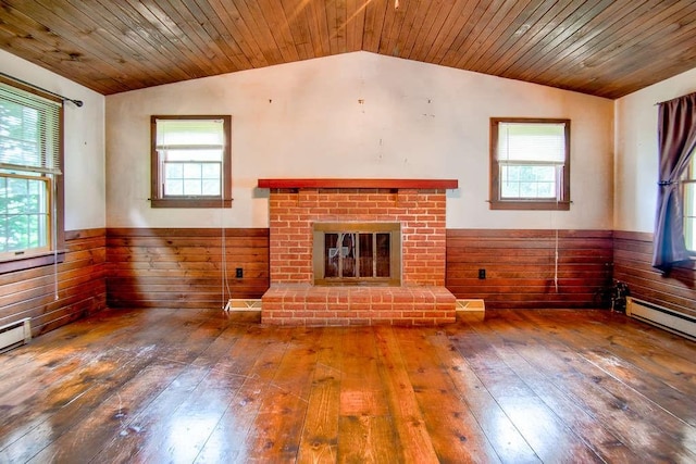 3444 Brodhead Rd, Center Twp, PA 15061 - unfurnished living room featuring vaulted ceiling, hardwood / wood-style floors, healthy amount of natural light, a fireplace, and a wainscoted wall
