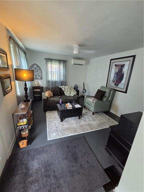 106 6th Ave, Ross Twp, PA 15229 - living room with an AC wall unit and baseboards