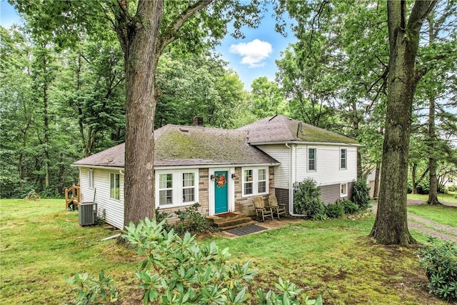 2725 N Neshannock Rd, Sharpsville, PA 16150 - tri-level home featuring entry steps, a front lawn, a chimney, roof with shingles, and stone siding
