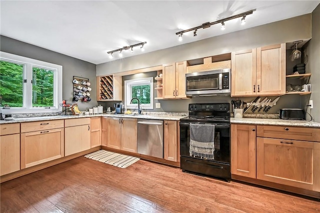 2725 N Neshannock Rd, Sharpsville, PA 16150 - kitchen with stainless steel appliances, open shelves, light brown cabinetry, and light wood-style floors