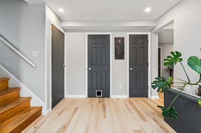 4 Thornridge Rd, Kilbuck Twp, PA 15202 - entrance foyer with light wood finished floors, stairway, and recessed lighting