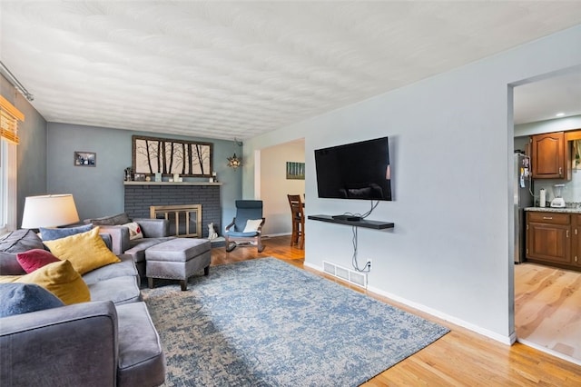 4 Thornridge Rd, Kilbuck Twp, PA 15202 - living area with light wood finished floors and a brick fireplace