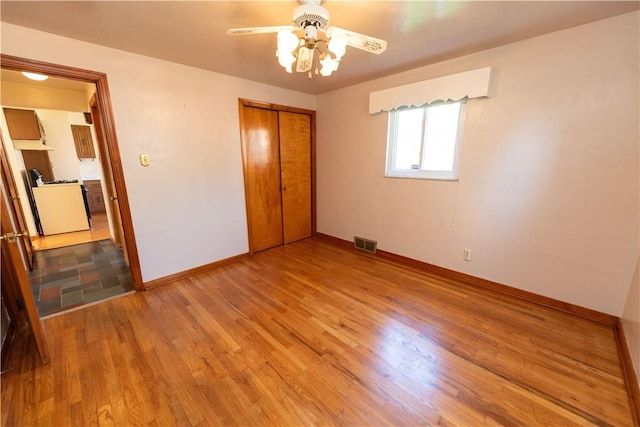 1819 Sundeman St, Troy Hill, PA 15212 - unfurnished bedroom with wood finished floors, a closet, and a ceiling fan