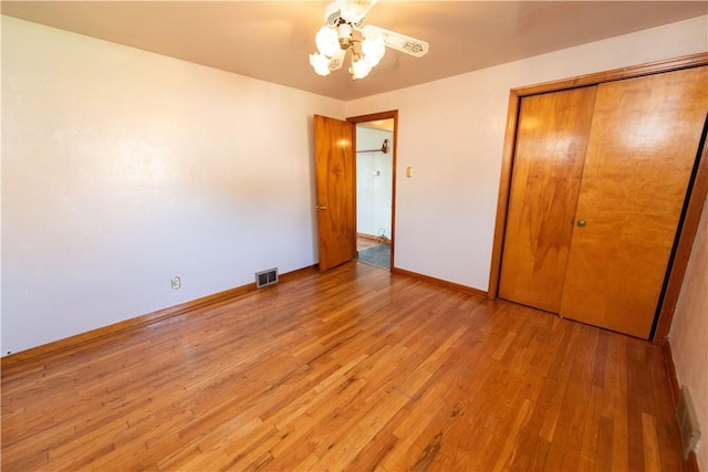 1819 Sundeman St, Troy Hill, PA 15212 - unfurnished bedroom with light wood-style flooring, a closet, and a ceiling fan