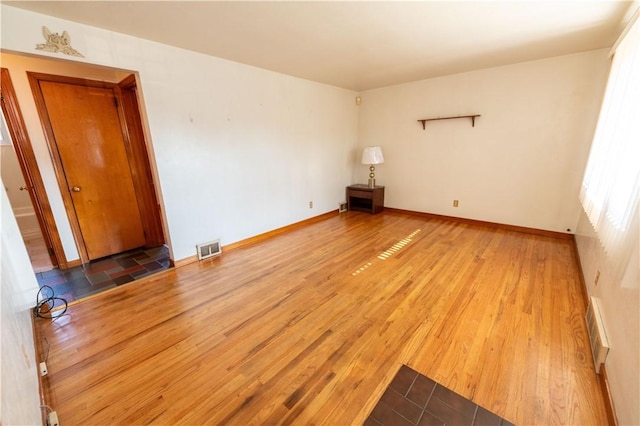 1819 Sundeman St, Troy Hill, PA 15212 - spare room featuring wood finished floors and baseboard heating