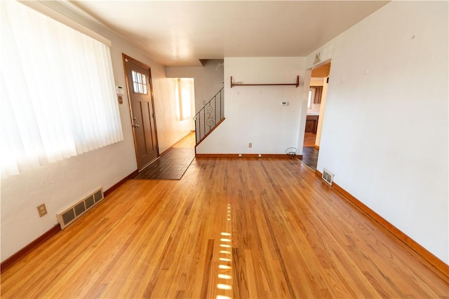 1819 Sundeman St, Troy Hill, PA 15212 - foyer featuring light wood finished floors and stairway