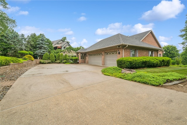 14 Amy Way S, Union Twp, PA 15401 - view of property exterior featuring brick siding, an attached garage, driveway, and roof with shingles