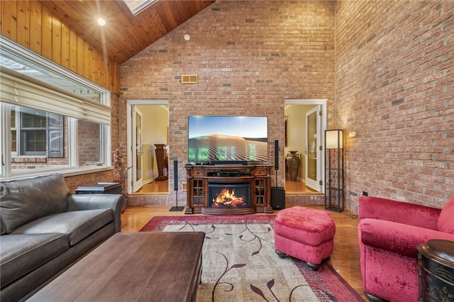 14 Amy Way S, Union Twp, PA 15401 - living area with high vaulted ceiling, brick wall, wood finished floors, a skylight, and wood ceiling