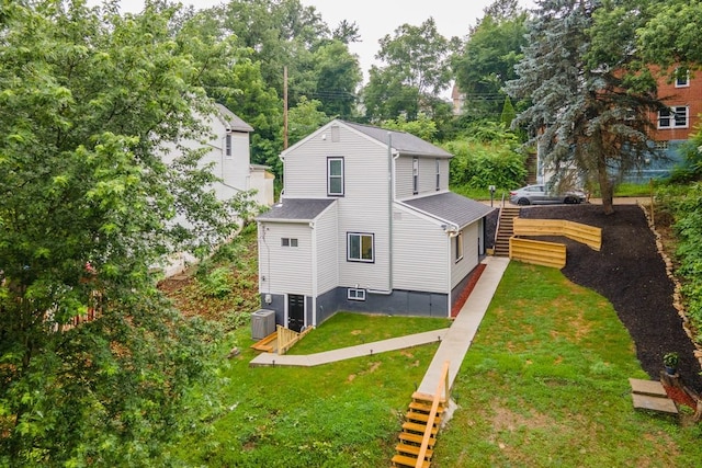 1819 Craig St, Mckeesport, PA 15132 - rear view of property featuring a lawn and view of wooded area