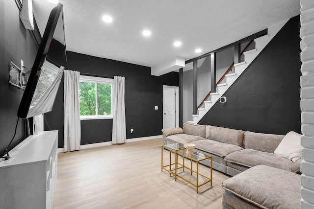 1819 Craig St, Mckeesport, PA 15132 - living area with light wood-style floors, recessed lighting, and stairs