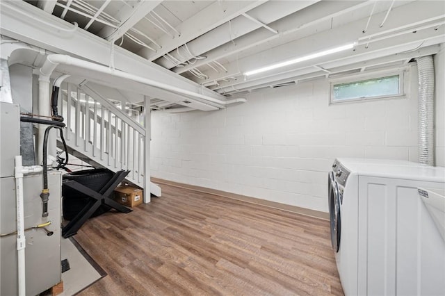 2047 Haymaker Rd, Monroeville, PA 15146 - basement featuring washing machine and clothes dryer, light wood-style floors, stairway, and concrete block wall