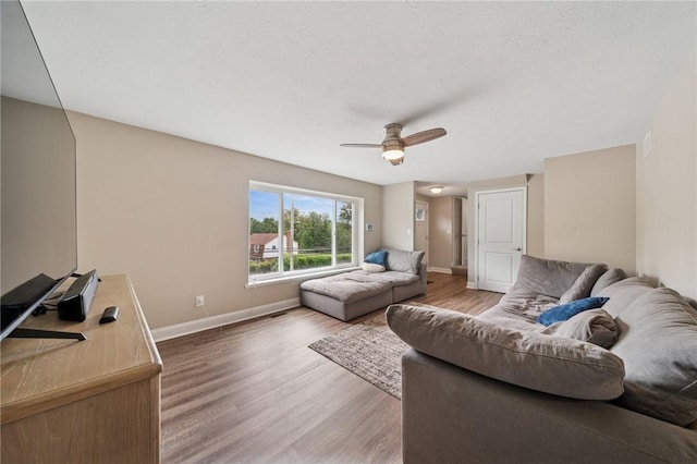 2047 Haymaker Rd, Monroeville, PA 15146 - living area with wood finished floors and a ceiling fan