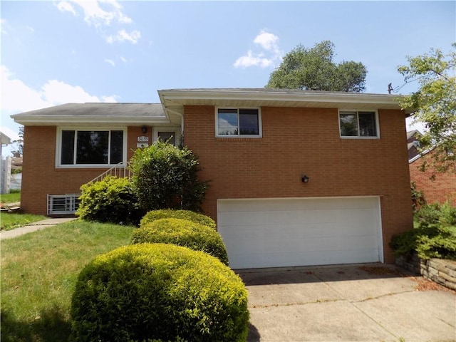 3055 Fadette St, Sheraden, PA 15204 - split level home featuring a garage, brick siding, and concrete driveway