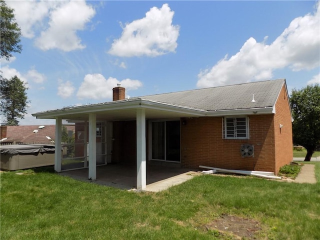 3055 Fadette St, Sheraden, PA 15204 - back of property featuring a chimney, a patio, brick siding, and a yard