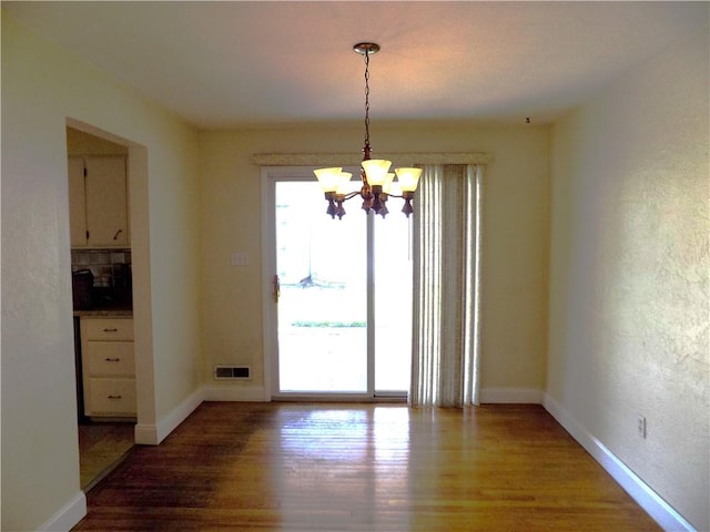 3055 Fadette St, Sheraden, PA 15204 - unfurnished dining area with a chandelier and wood finished floors