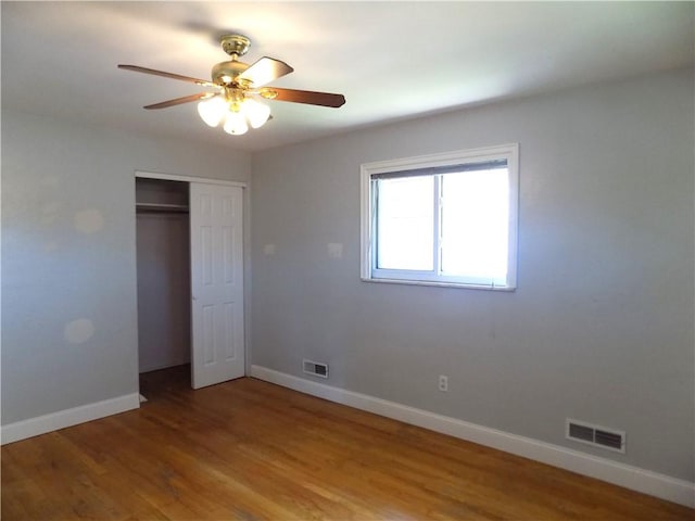 3055 Fadette St, Sheraden, PA 15204 - unfurnished bedroom with a closet, wood finished floors, and a ceiling fan