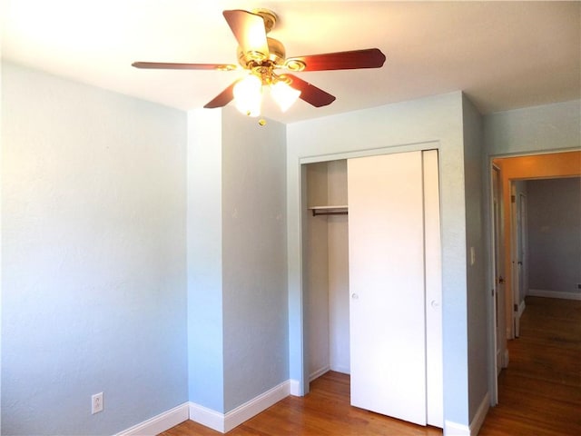 3055 Fadette St, Sheraden, PA 15204 - unfurnished bedroom featuring wood finished floors, a closet, and a ceiling fan