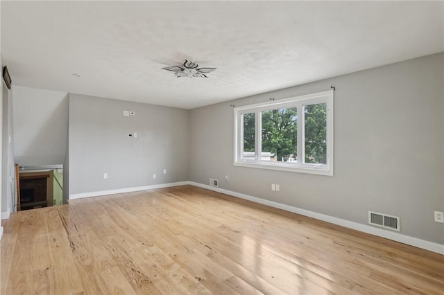1717 Gina Dr, West Mifflin, PA 15122 - unfurnished living room featuring baseboards and light wood-style flooring