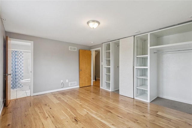 1717 Gina Dr, West Mifflin, PA 15122 - unfurnished bedroom featuring wood finished floors and connected bathroom