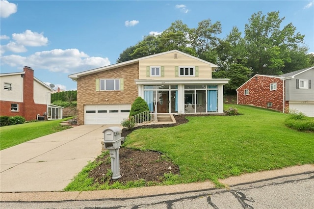 1717 Gina Dr, West Mifflin, PA 15122 - view of front of house with an attached garage, driveway, and a front yard
