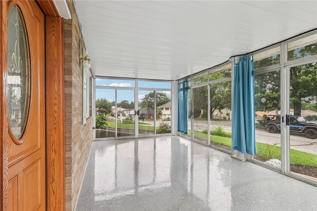 1717 Gina Dr, West Mifflin, PA 15122 - unfurnished sunroom featuring expansive windows and speckled floor