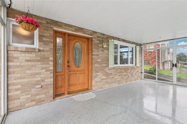 1717 Gina Dr, West Mifflin, PA 15122 - view of exterior entry featuring brick siding and a porch
