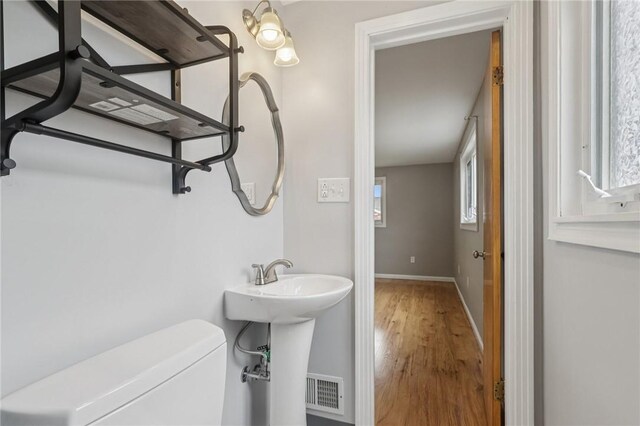 1717 Gina Dr, West Mifflin, PA 15122 - half bathroom with wood finished floors and toilet